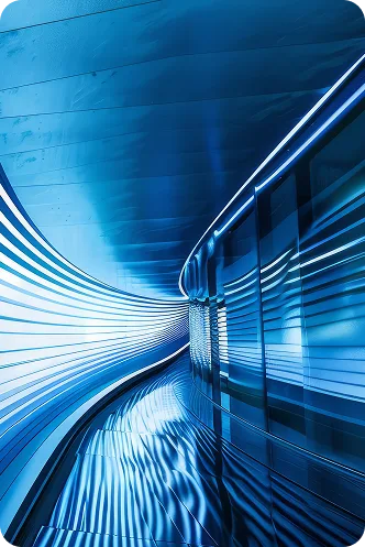 Blue futuristic curved tunnel or passageway with reflective walls and light stripes, suggesting speed and motion in transit design by design.